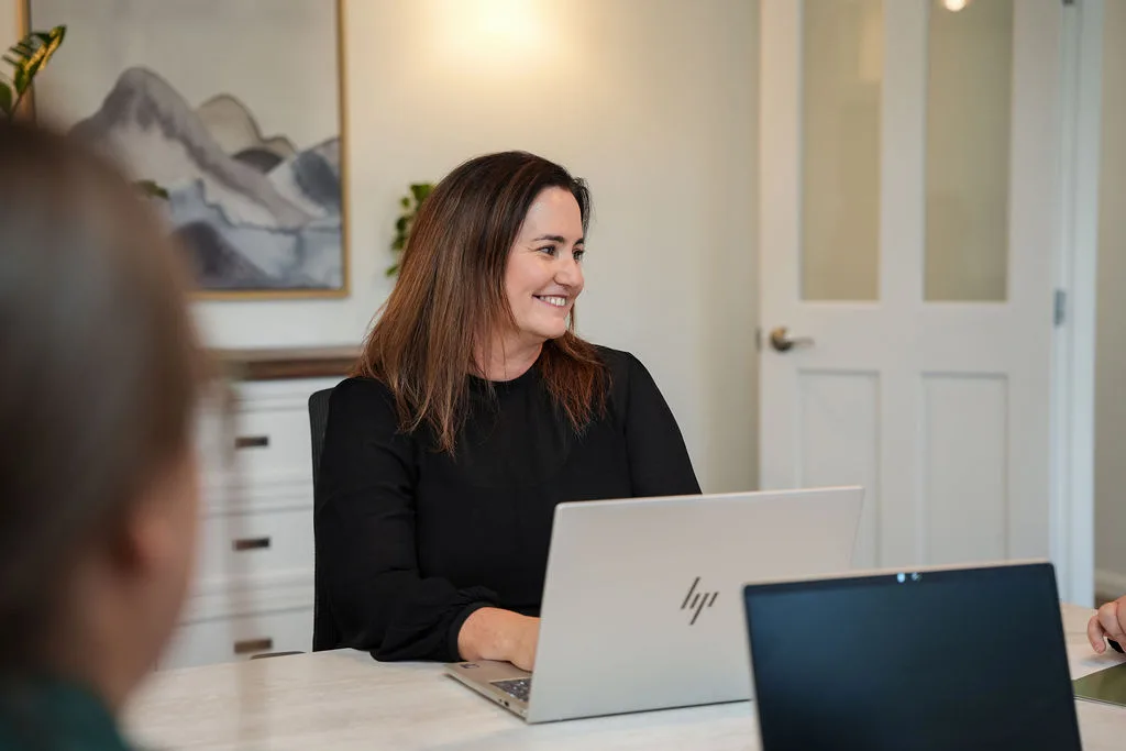KGA director Jen Smith working through management reporting with a client